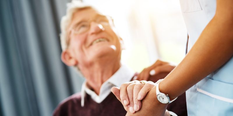 Someone showing kindness to an elderly person.