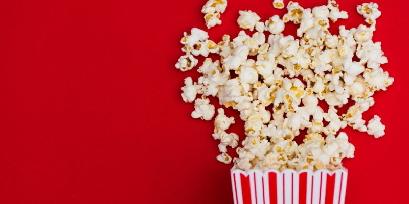 a box of popcorn on a beautiful red background