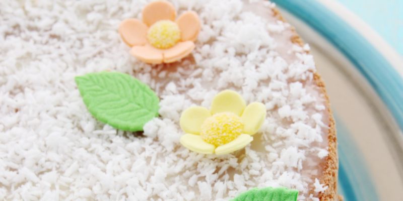A plate with a decorated coconut torte