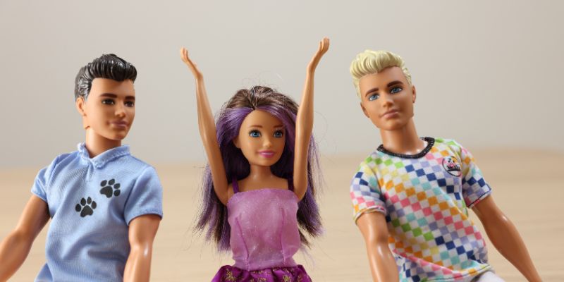 Ken, Barbie and another male friend