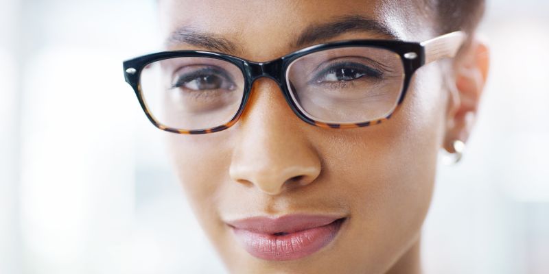 An attractive person with glasses on