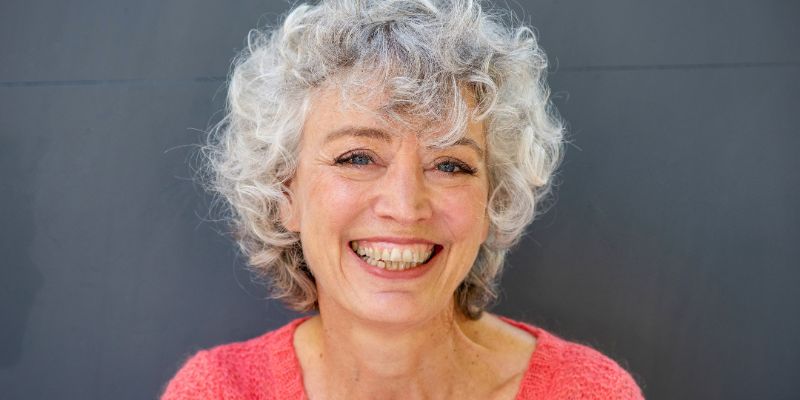 A woman smiling