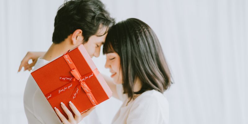 a man giving a woman a gift