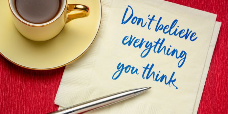 Do not believe everything you think note on a napkin