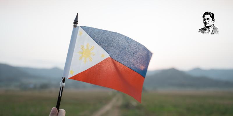 Someone holding a small phillipine flag
