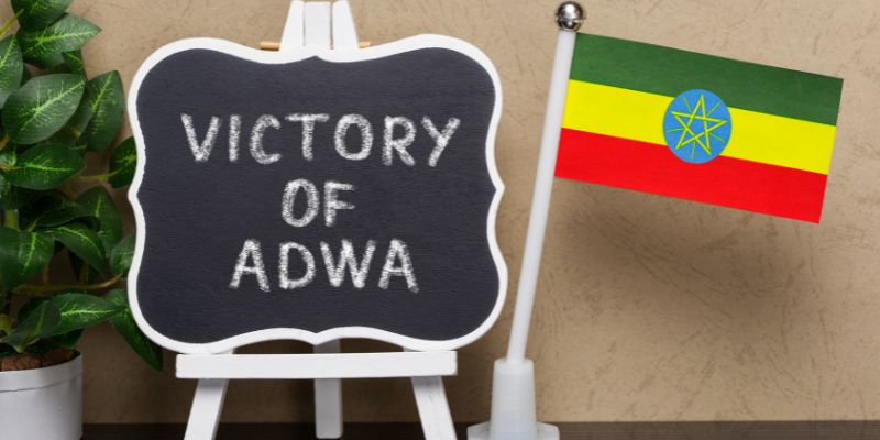 Sign that reads "Victory of Adwa" and an Ethiopian flag.