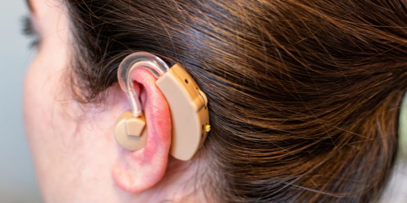someone with a hearing aid