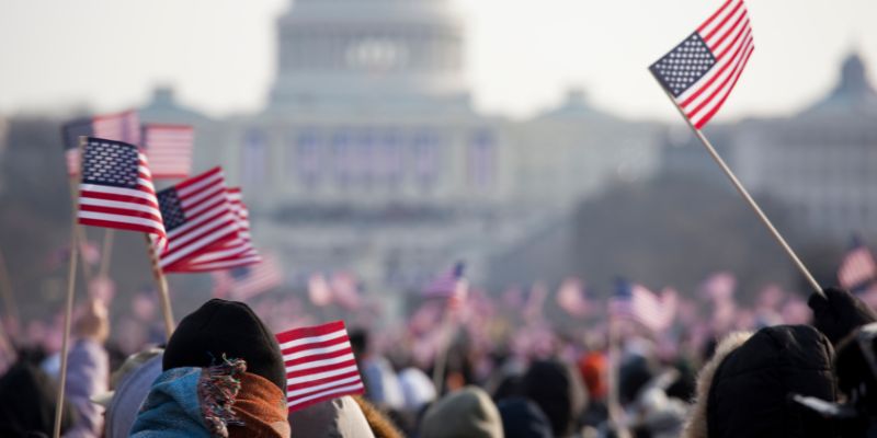 People holding american flags
