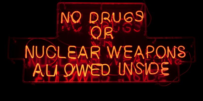 No durgs or nuclear weapons allowed inside sign.