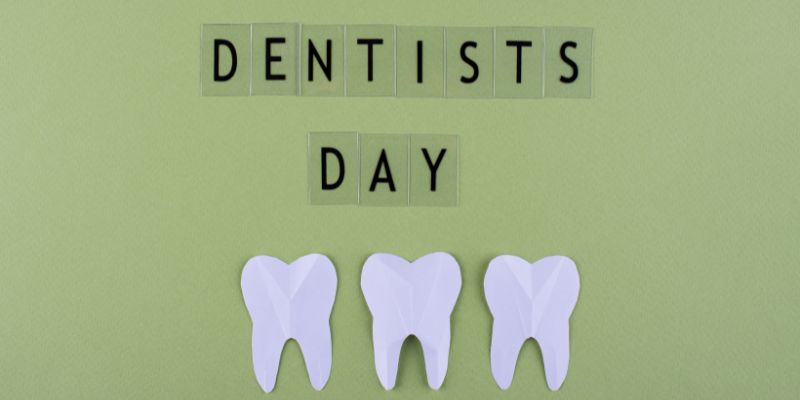 Dentists Day sign with molars under it