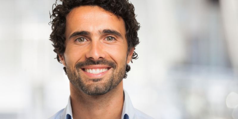 A smiling man.