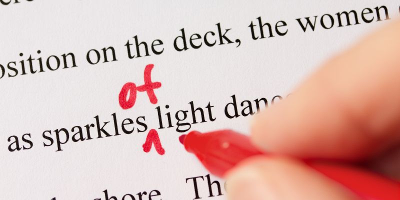 Someone proofreading and editing a document