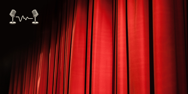 A stage with red curtain.