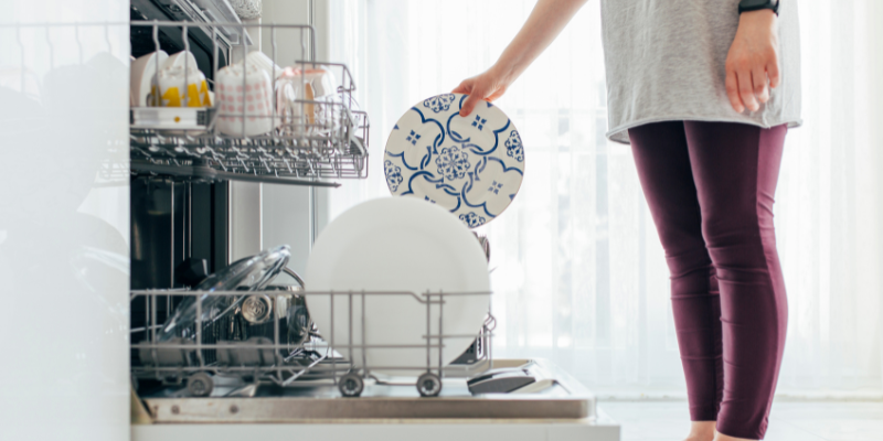 Someone loading a dishwasher