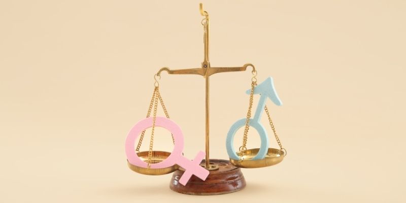 Scale balance a pink and a blue symbol