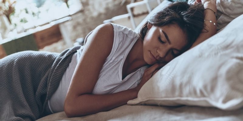 Someone sleeping on a bed