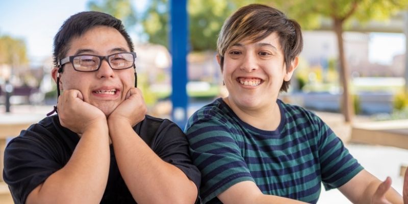 Two children smiling at the camera.