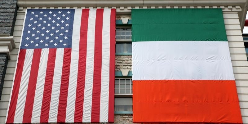 A US Flag and Ireland Flag draped on a house