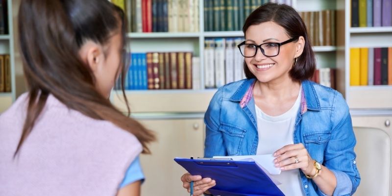 Social worker talking with a client