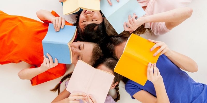 Four children reading books
