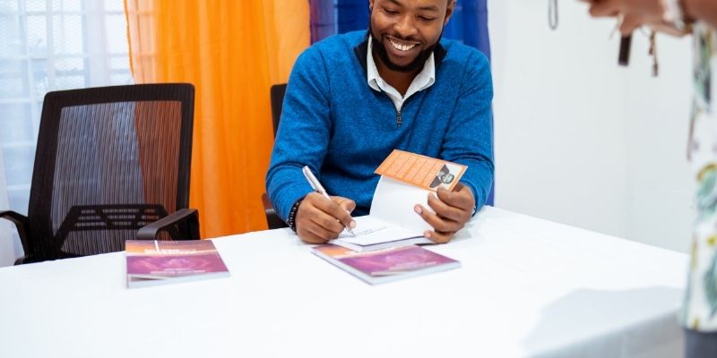 Author signing a book