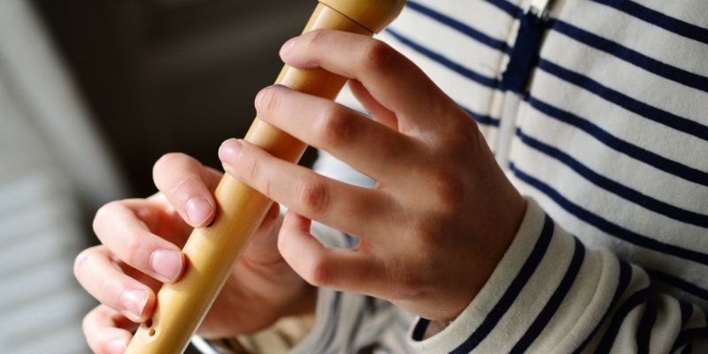 someone playing a recorder