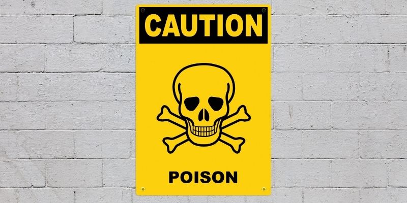 A yellow caution sign with a skeleton head