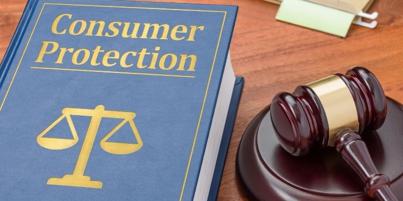 Book that says consumer  protection with a gavel next to it.