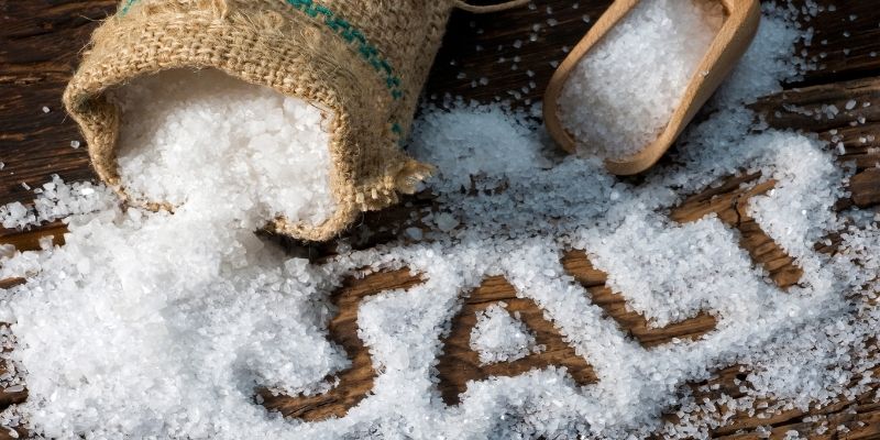 Salt in a burlap bag and on the surface